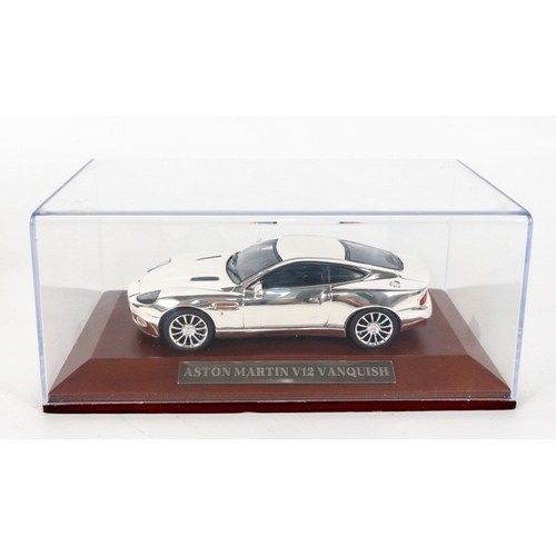 110 - JAMES BOND - Vitesse V087C Aston Martin DB4 1960 dark blue in Perspex case, plus an Aston Martin V12... 