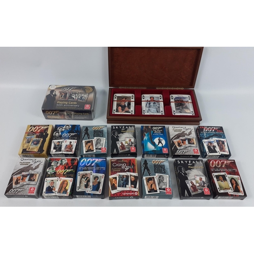 141 - JAMES BOND - playing cards galore including a wooden box with three unopened packs of 007 cards, a s... 