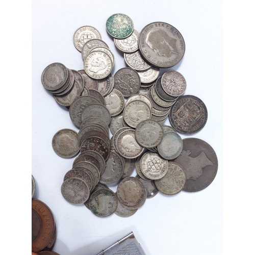 23 - A small bag of assorted coins to include a small amount of silver weighing 135g approx.#23