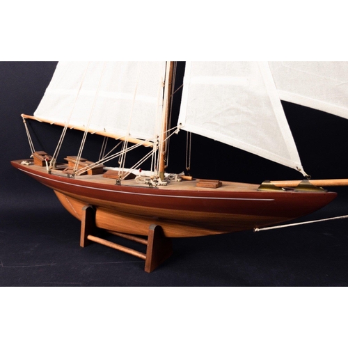 242 - Large and impressive model of a yacht on a stand and in good condition.  Likely to have been kit bui... 