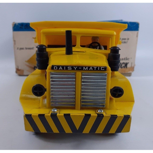 243 - A vintage 1960'S DAISY MATIC No. 62 dump truck in fairly good condition with box (in poor condition)... 