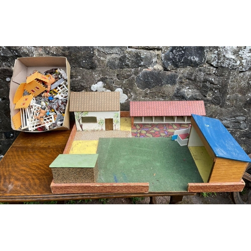 254 - An old kiddies playworn farmyard with a box of farmyard animals etc - dimension 60cm x 45cm#254