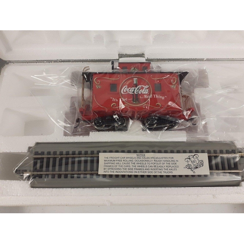 264 - COCA COLA - From the Hawthorne Village collection a COCA COLA Tanker boxed, a boxed COCA COLA Caboos... 