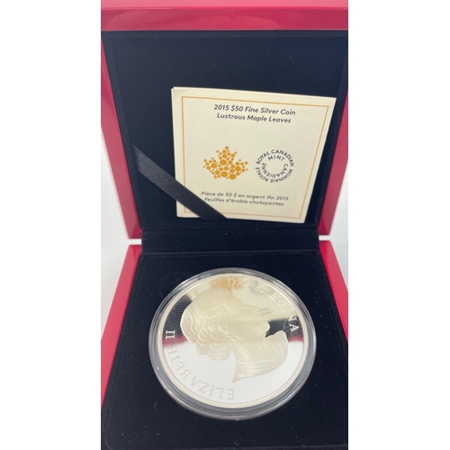 29 - Royal Canadian Mint $50 fine silver hologram coins lustrous maple leaves both encased 2013 and 2015 ... 