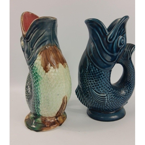 386 - Two glug jugs one being navy blue by DARTMOUTH standing 23cm high and undamaged, the other multi-col... 