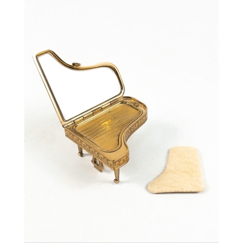 52 - One for the Compact collectors !  A beautiful gilt gold compact in the form of a grand piano with re... 