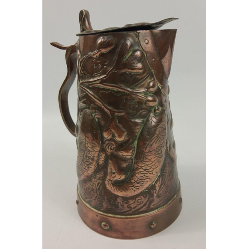 65 - A NEWLYN style Arts & Crafts beaten copper lidded jug with design of four leaping fish, stands a... 