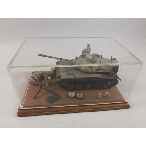 84 - Interesting diorama depicting American tank in perspex case with oil drums, sandbags, tracks. THe ta... 