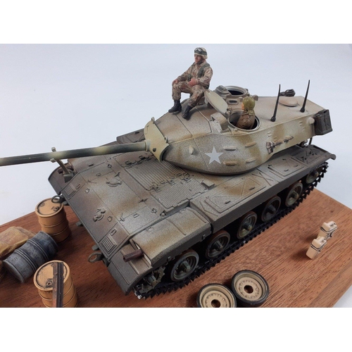 84 - Interesting diorama depicting American tank in perspex case with oil drums, sandbags, tracks. THe ta... 