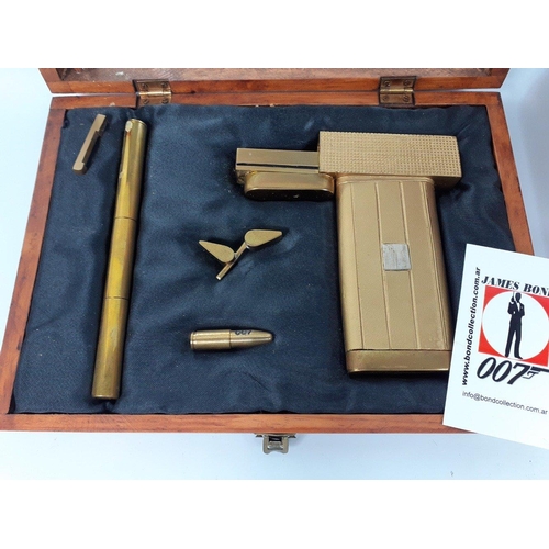 94 - JAMES BOND 007.  THE MAN WITH THE GOLDEN GUN.  Two boxed Golden Guns in wooden presentation cases.  ... 