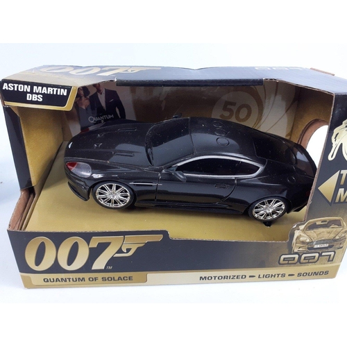 99 - JAMES BOND - three Toy State 007 motorized lights and sounds model cars to include a black ASTON MAR... 