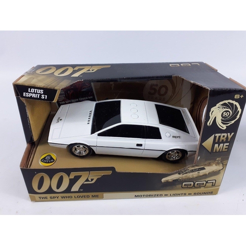 99 - JAMES BOND - three Toy State 007 motorized lights and sounds model cars to include a black ASTON MAR... 