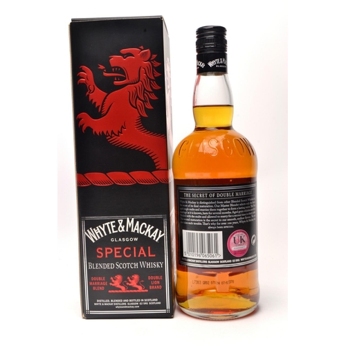 514 - WHYTE & MACKAY Glasgow 'Special' whisky 70cl within its black and red liveried presentation cart... 