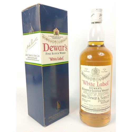 528 - A bottle of DEWARS WHITE LABEL the Imperial Quart size bottle of 86.8 proof blended was bottled for ... 