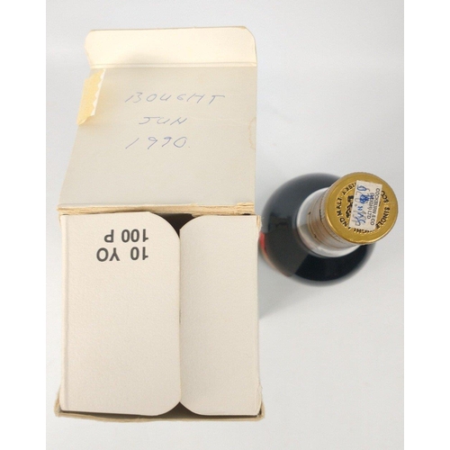 575 - MACALLAN - A boxed bottle of 100 PROOF Macallan 75cl purchased in June 1990 - the box is worn but in... 