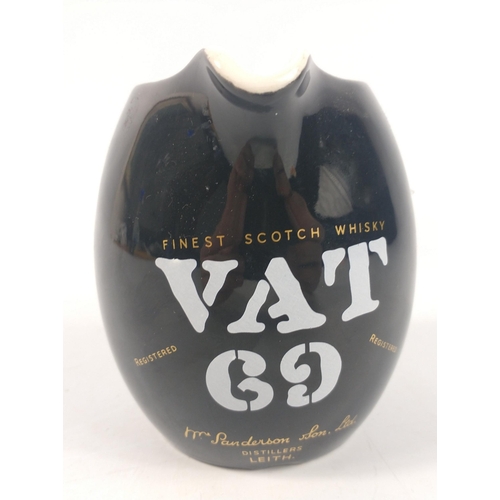 652 - A collectable VAT69 whisky water jug 11cm height x 7cm across#178