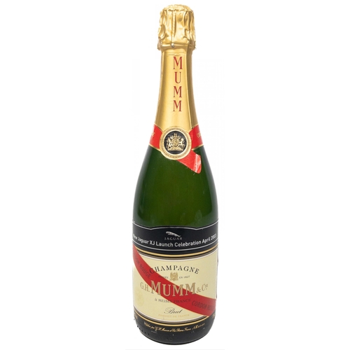 675 - A MUMM bottle of CHAMPAGNE celebrating the NEW JAGUAR XJ LAUNCH. The item is sold as described and w... 