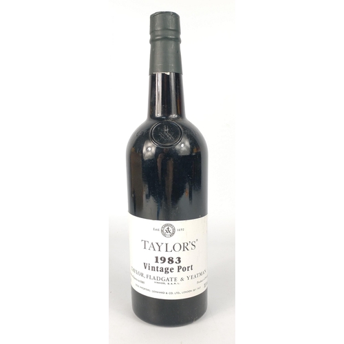 694 - A bottle of TAYLOR'S 1983 Vintage Port bottled in Oporto in 1985. The item is sold as described and ... 