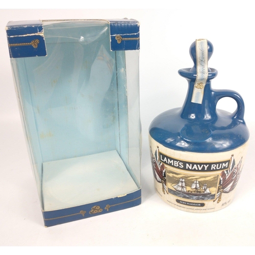 710 - A 75cl ceramic decanter of LAMB'S NAVY RUM commemorating HMS WARRIOR. The item is sold as described ... 