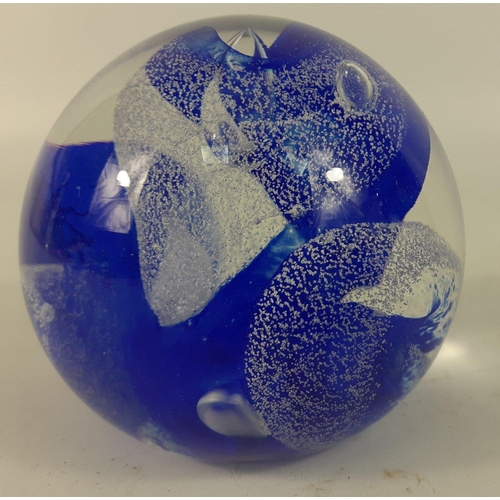 103 - A CAITHNESS GLASS paperweight with blue and white wave designs marked to the base CG#114