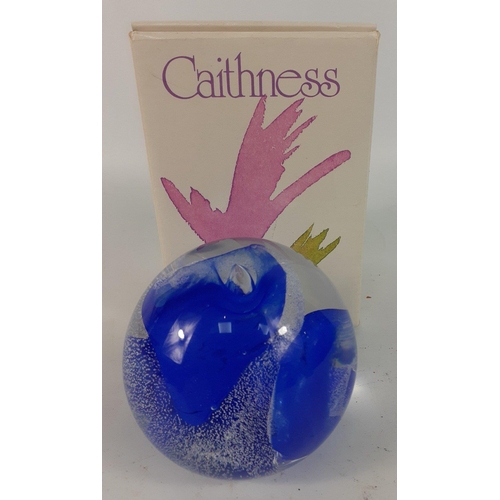 103 - A CAITHNESS GLASS paperweight with blue and white wave designs marked to the base CG#114