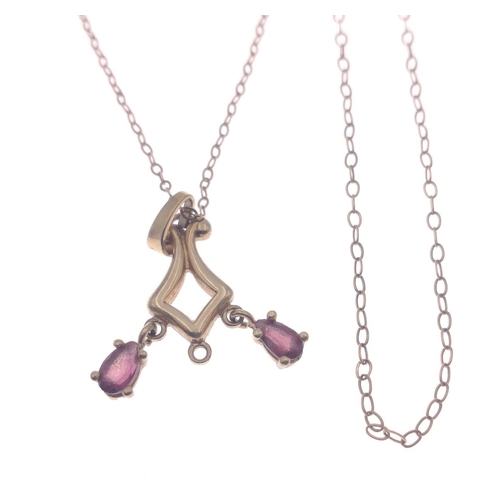 11 - A stamped 9k yellow gold pendant with a purple amethyst on a 375 stamped chain gross weight 2.10g an... 