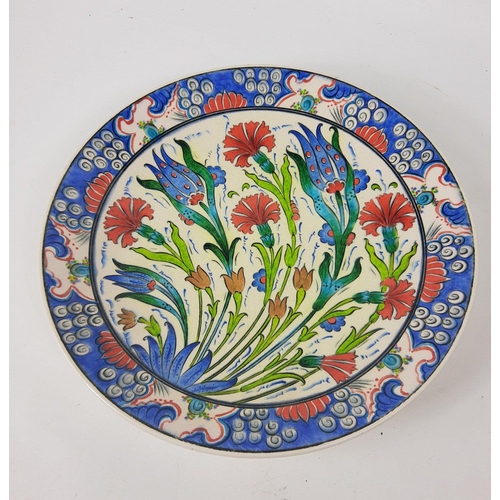 124 - A bright and colourful hand-made charger with floral design, comes from Turkey 31cm diameter approx#... 