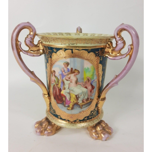 125 - A three handled Vienna heavily gilded pottery vase with a beehive base mark, stands approx 20cm tall... 