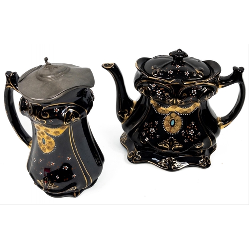 133 - A late Victorian teapot (18cm high approx) on its own trivet with matching jug with pewter lid (20cm... 