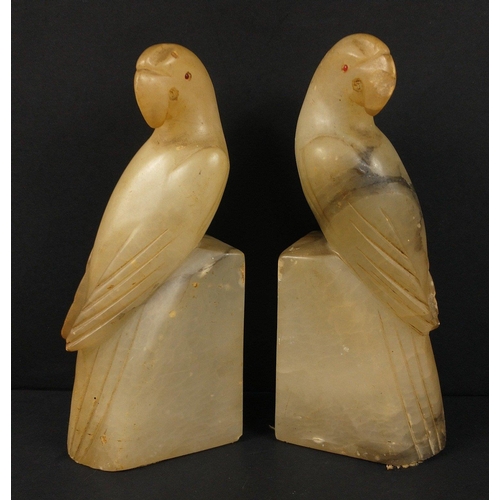 137 - A pair of onyx parrot bookends standing 18cm tall, a few small chips#148