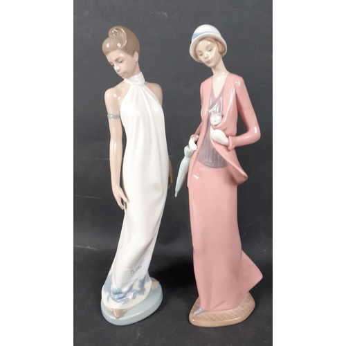 139 - Two 31cm tall NAO by LLADRO figures of 1920s style FLAPPER GIRLS one in a white dress and the other ... 