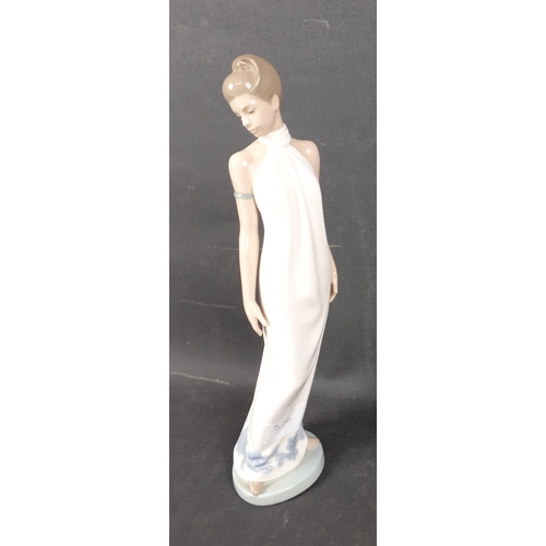 139 - Two 31cm tall NAO by LLADRO figures of 1920s style FLAPPER GIRLS one in a white dress and the other ... 