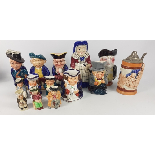 144 - A selection of 13 CHARACTER JUGS ranging in size from 7cm to 21cm tall and a BEER STEIN#155