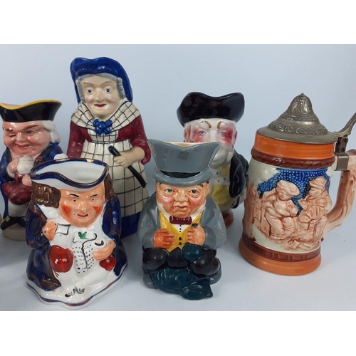 144 - A selection of 13 CHARACTER JUGS ranging in size from 7cm to 21cm tall and a BEER STEIN#155