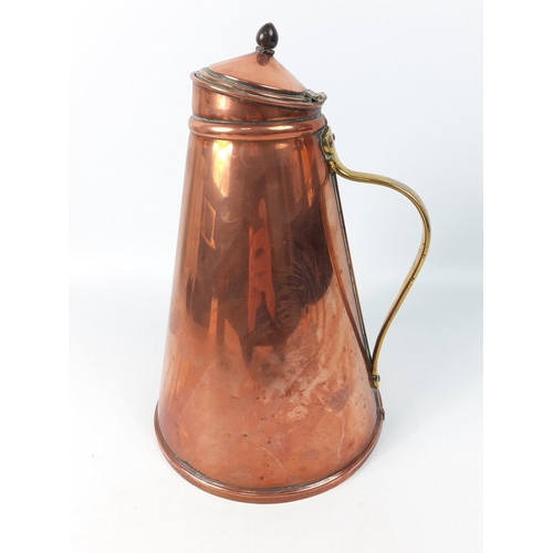 165 - A large conical shaped vintage copper jug with brass handle.  Welded base.  Stands 27cm high approx ... 