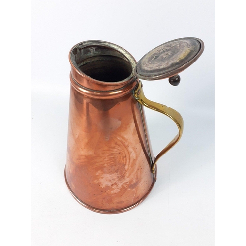 165 - A large conical shaped vintage copper jug with brass handle.  Welded base.  Stands 27cm high approx ... 