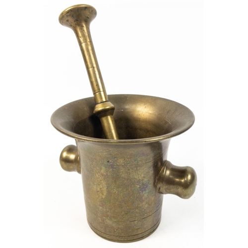 166 - Substantial nineteenth century brass mortar and pestle with side handle. 14cm high approx.  Pestle m... 