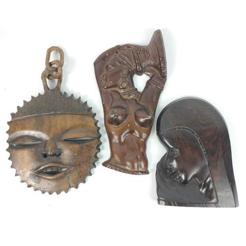 168 - A trio of African tribal items to include a wooden mask of a woman (22x15cm approx), a full face mas... 