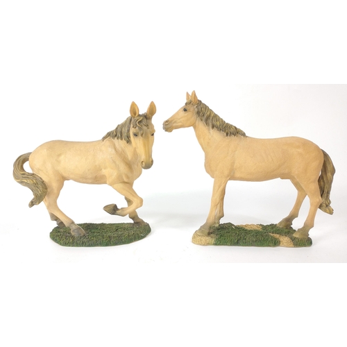 172 - Two alert resin horses, the taller standing 22cm high#183