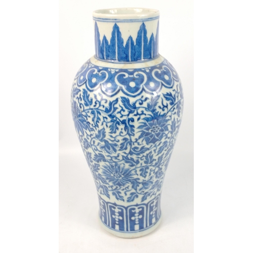 175 - A vintage blue and white Chinese vase 40cm high with a scrolling floral pattern, no marks to the bas... 