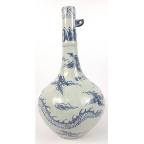 177 - An antique blue glaze Chinese tall-necked vase with a decoration of chasing dragons, and a hoop for ... 