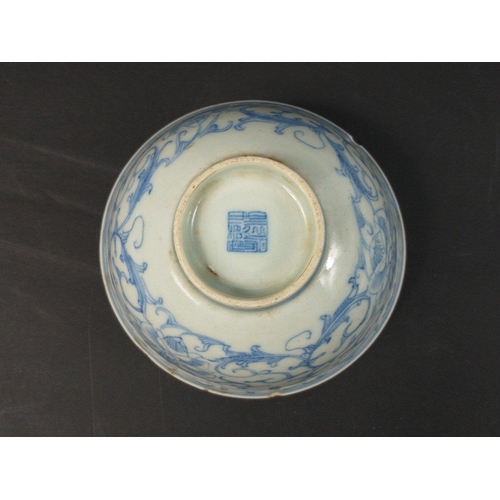 179 - A small Chinese bowl (11cm dia) with a scrolled floral design, with marking to base, a few minor cra... 