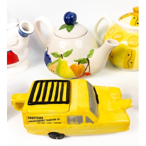 192 - A selection of NOVELTY TEAPOTS including Del Boy's 3 wheeler, some damage to the pots#203