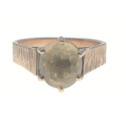 2 - A 9ct stamped yellow gold ring in a bark effect finish size M with a SUBSTANTIAL white stone - gross... 