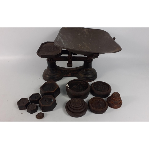 213 - Vintage cast iron table top balance scales marked '' To weigh 14 lbs''  with tin pan.  Comes with a ... 