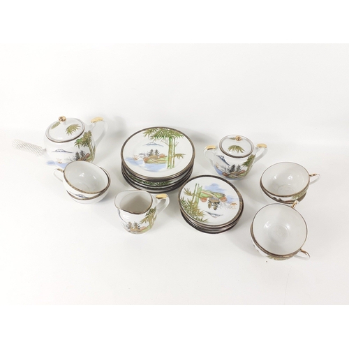 218 - A Japanese Tea Set with GEISHA imprint design on base of cups. 6 cups, saucers, plates. Tea pot and ... 