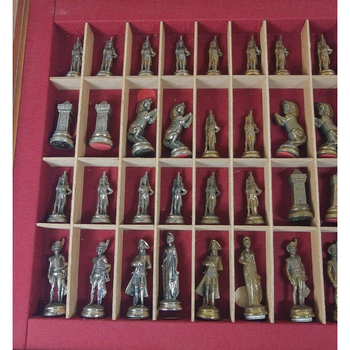 221 - A boxed chess set with metal pieces all contained in a decorative wooden case with sliding chess boa... 