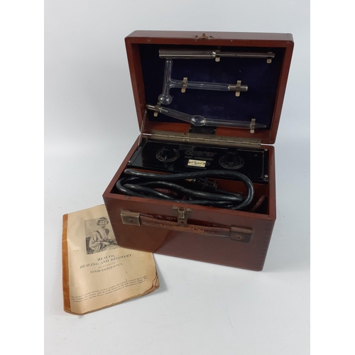 231 - An EVERAY plasma electrotherapy kit in a walnut case with a handy booklet of instructions and specia... 