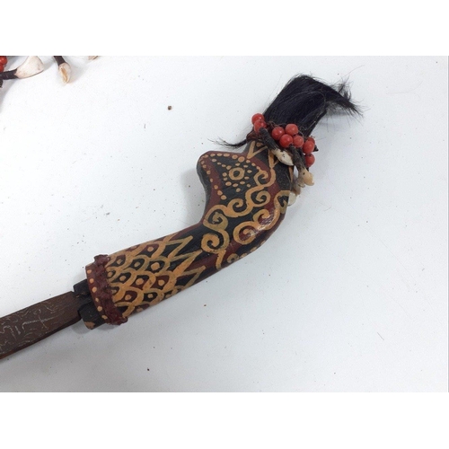 234 - Highly decorated Indonesian / Asian Kris style sword in elaborate sheath decorated with animal teeth... 