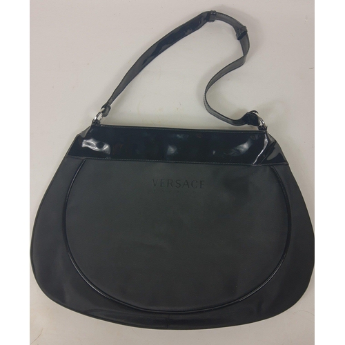 248 - A black fabric shoulder bag with patent shoulder and strap labelled Versace Parfums, 1 zipped compar... 